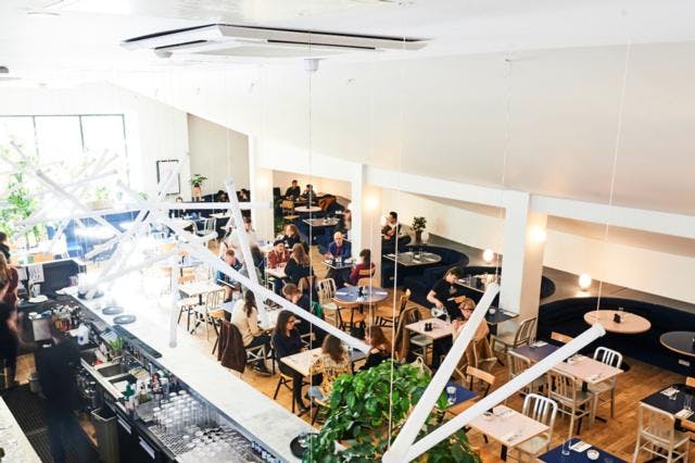 Vibrant café at Bar + Kitchen, perfect for networking events and casual meetups.