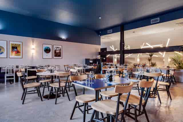 Modern restaurant Bar + Kitchen in EartH, ideal for events with flexible seating.