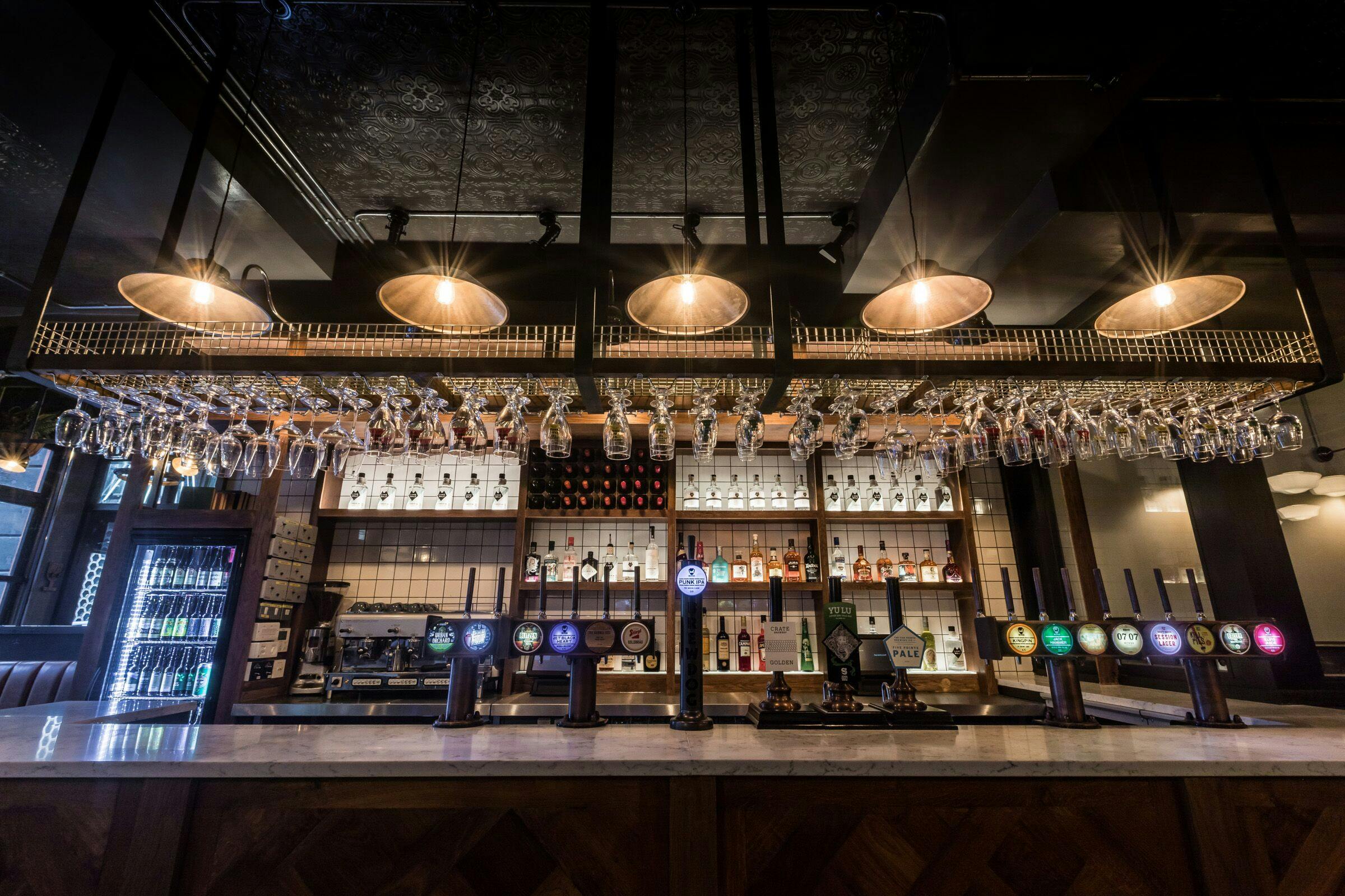 Stylish bar setup in Draft House Farringdon for networking events and cocktail receptions.