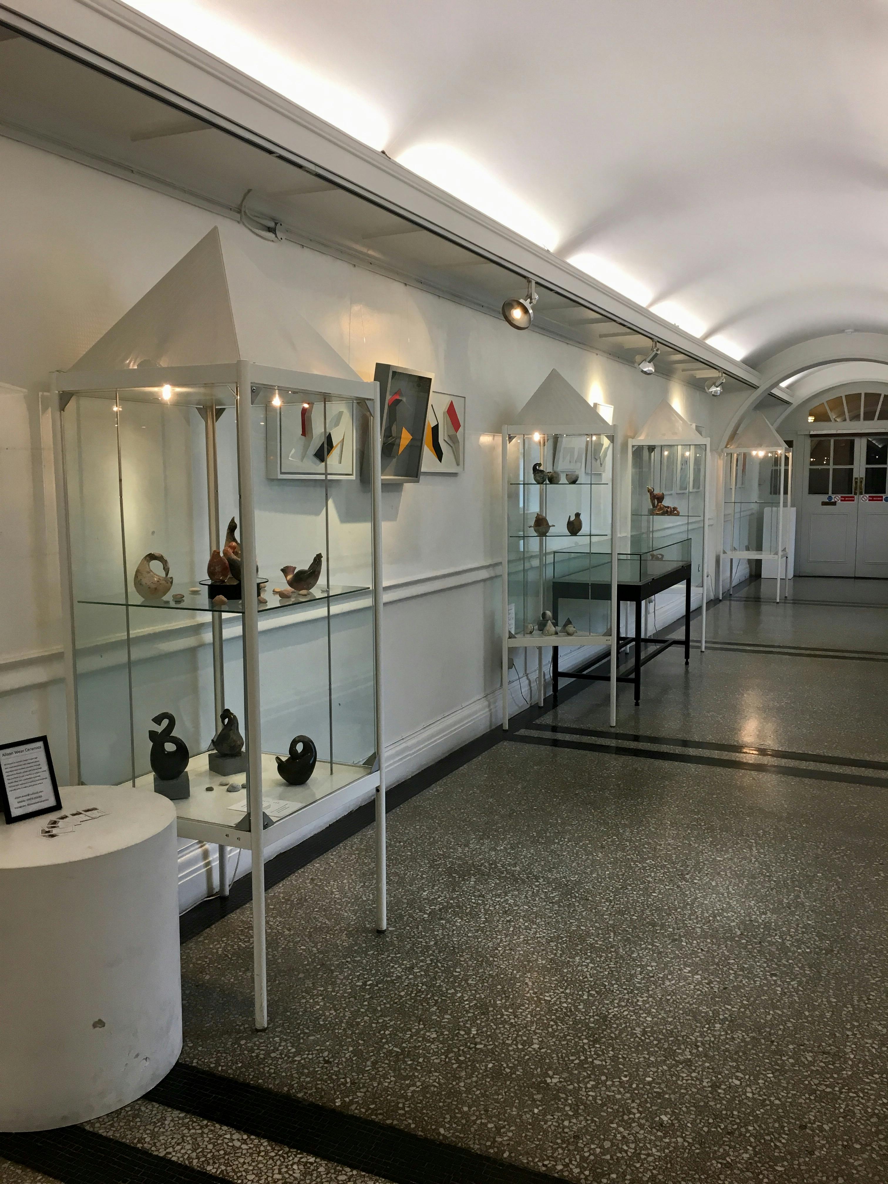 Chelsea Gallery exhibition space with glass displays, ideal for art events and networking.