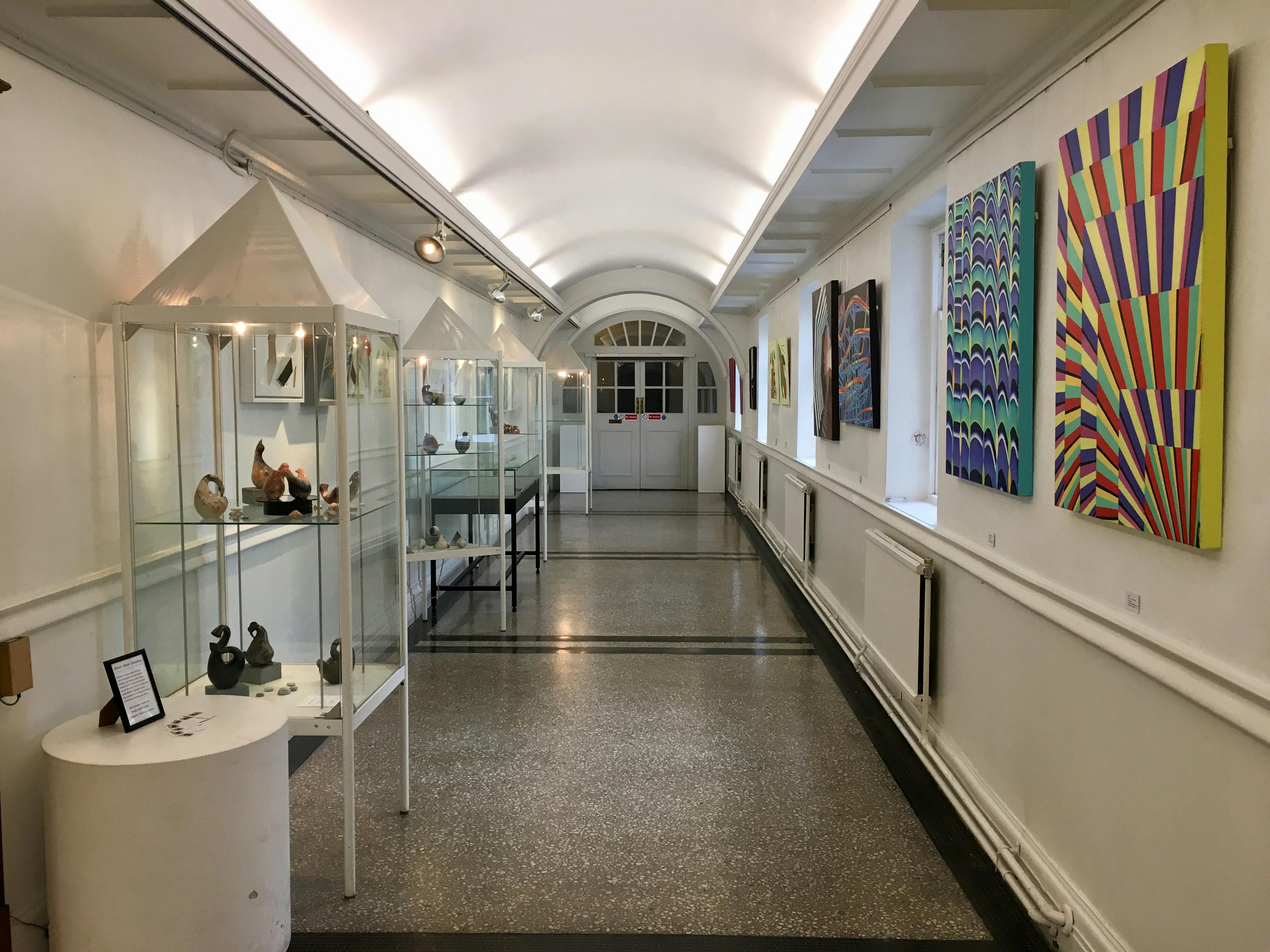 Chelsea Gallery in Chelsea Library with vibrant artwork, perfect for art exhibitions and receptions.