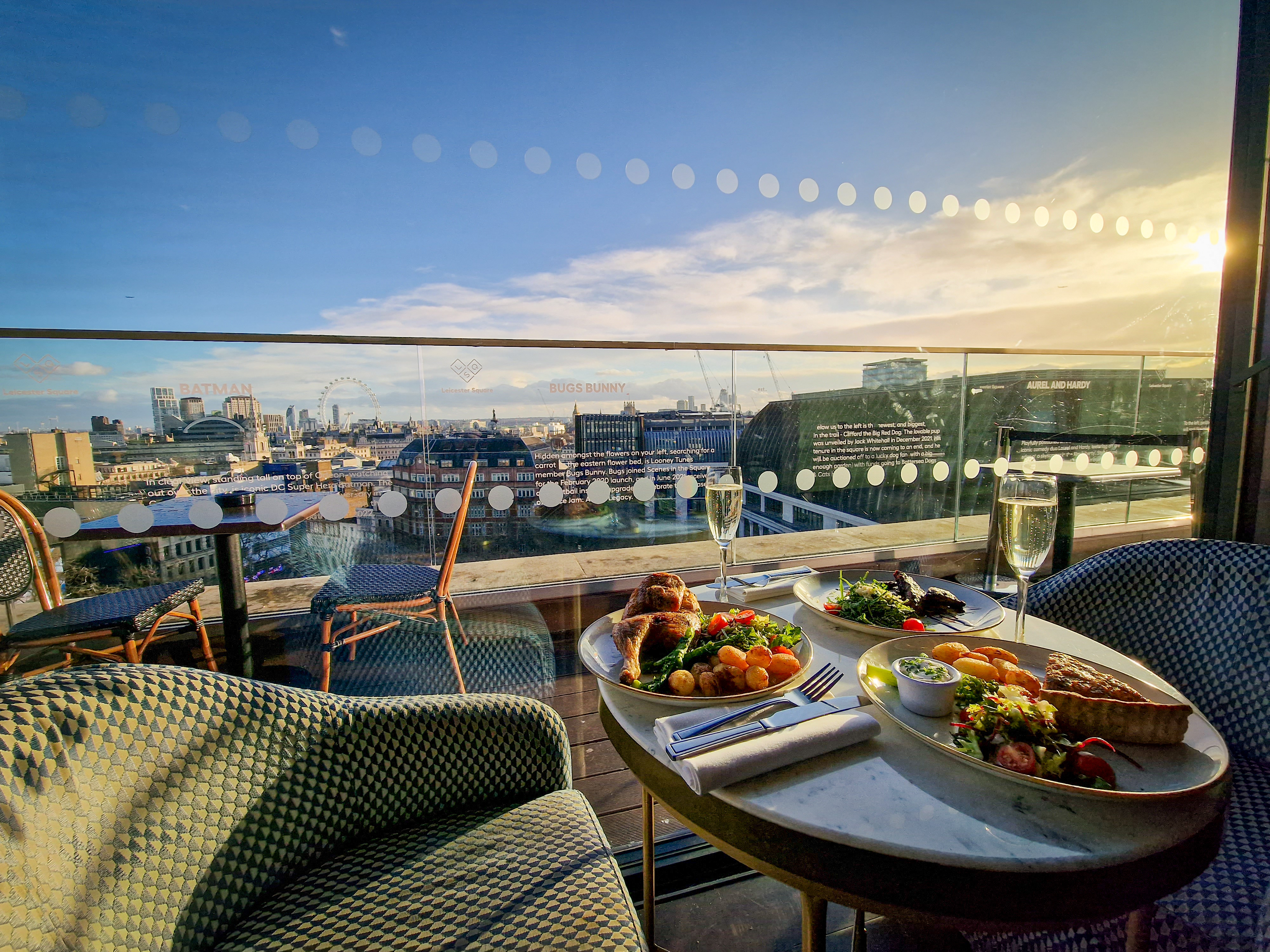 Rooftop dining setup at The View @LSQ with gourmet food and city skyline, perfect for events. - Banner