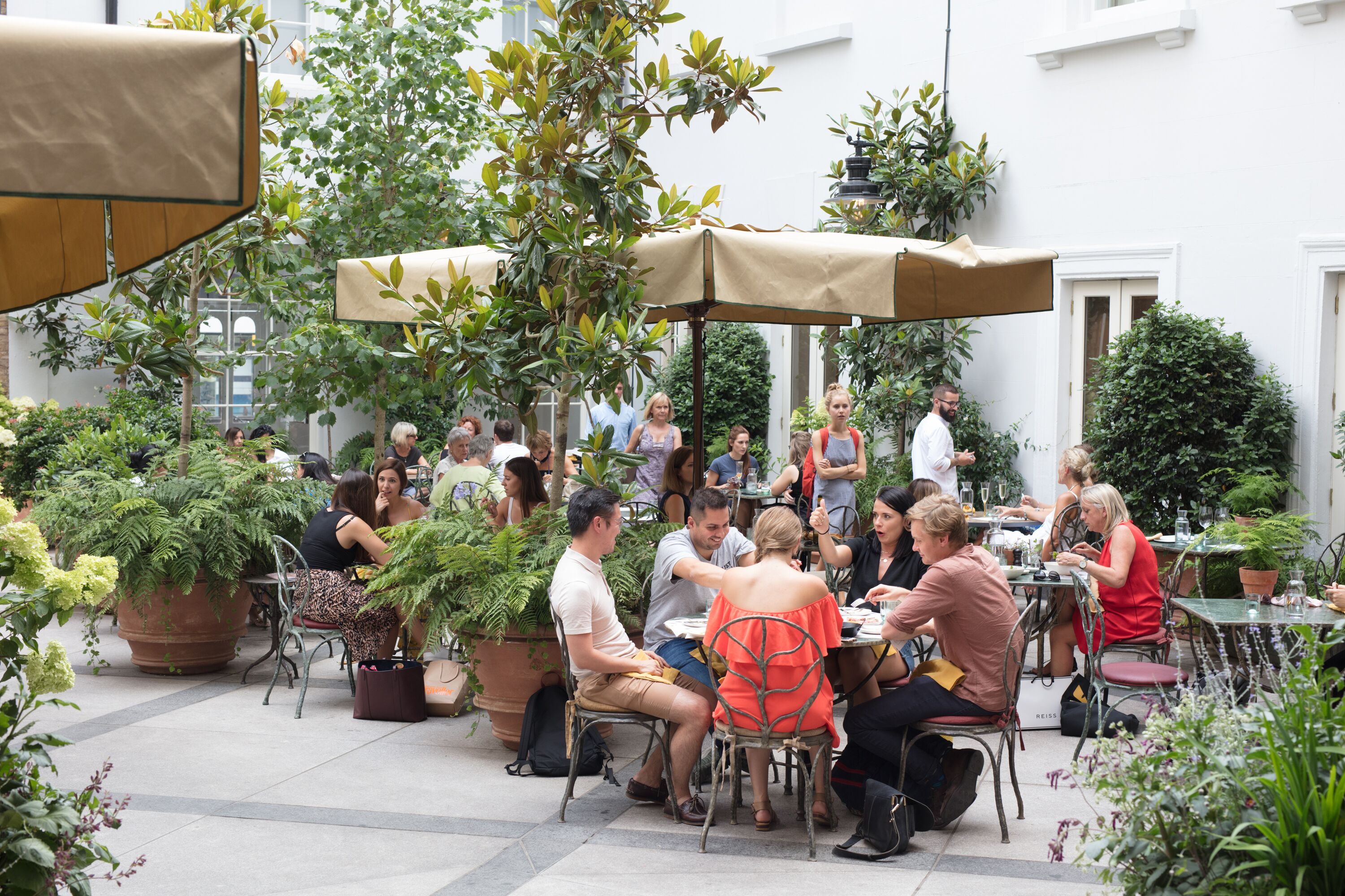 Outdoor gathering space at La Goccia, ideal for networking events and casual meetings.