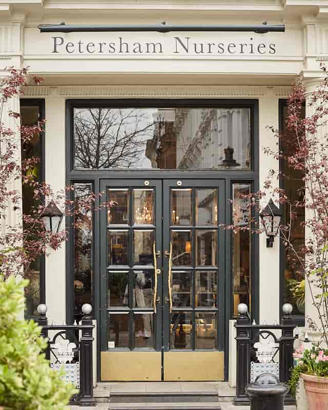 Elegant entrance of The Shop at Petersham Nurseries, perfect for corporate events.