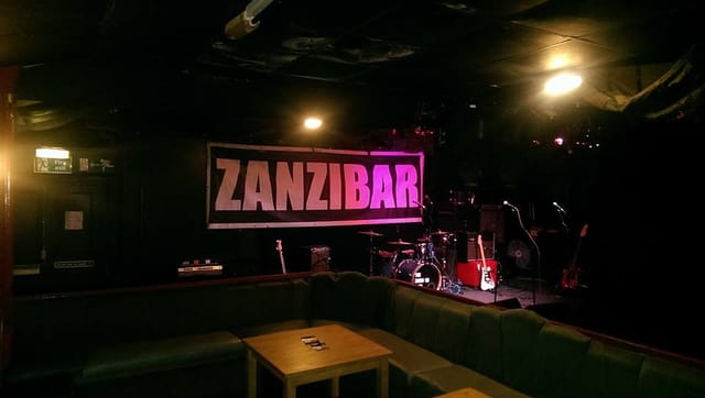 Intimate live music venue The Zanzibar with stage set for captivating performances.
