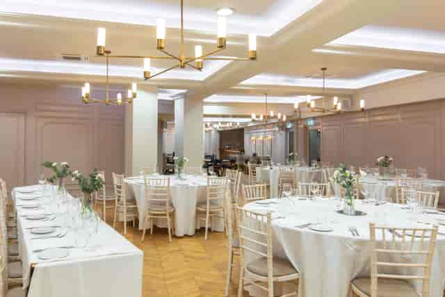 Elegant Coach House function room with Chiavari chairs for wedding receptions and formal dining.