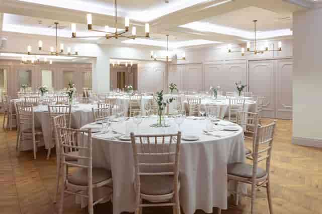 Elegant Coach House banquet space with herringbone floors, perfect for upscale weddings and events.