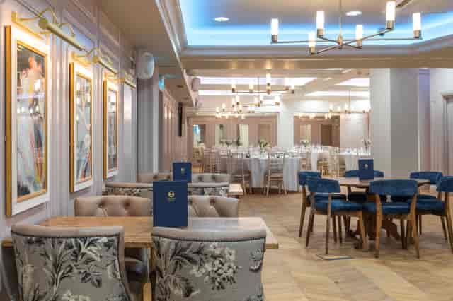 Coach House event space at The Dog & Fox with banquet seating for dinners and networking.