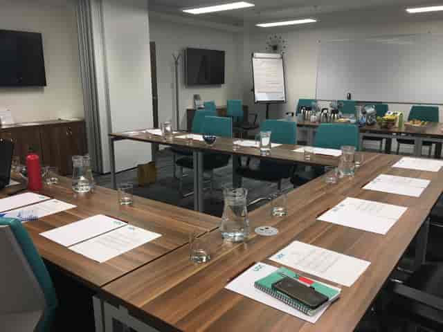 Boston Manor Suite meeting room with rectangular table, ideal for professional gatherings.