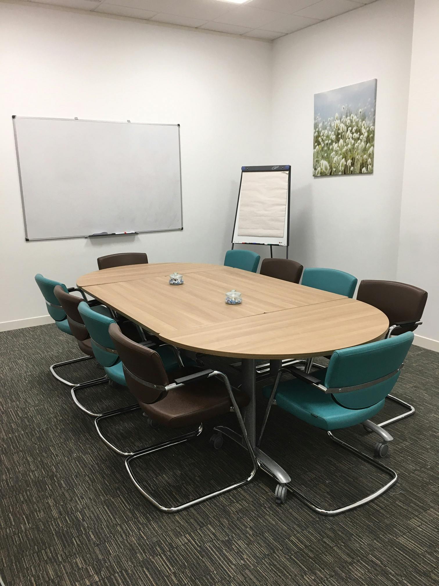 Lancaster Suite meeting room with oval table, ideal for collaborative events at UBC.