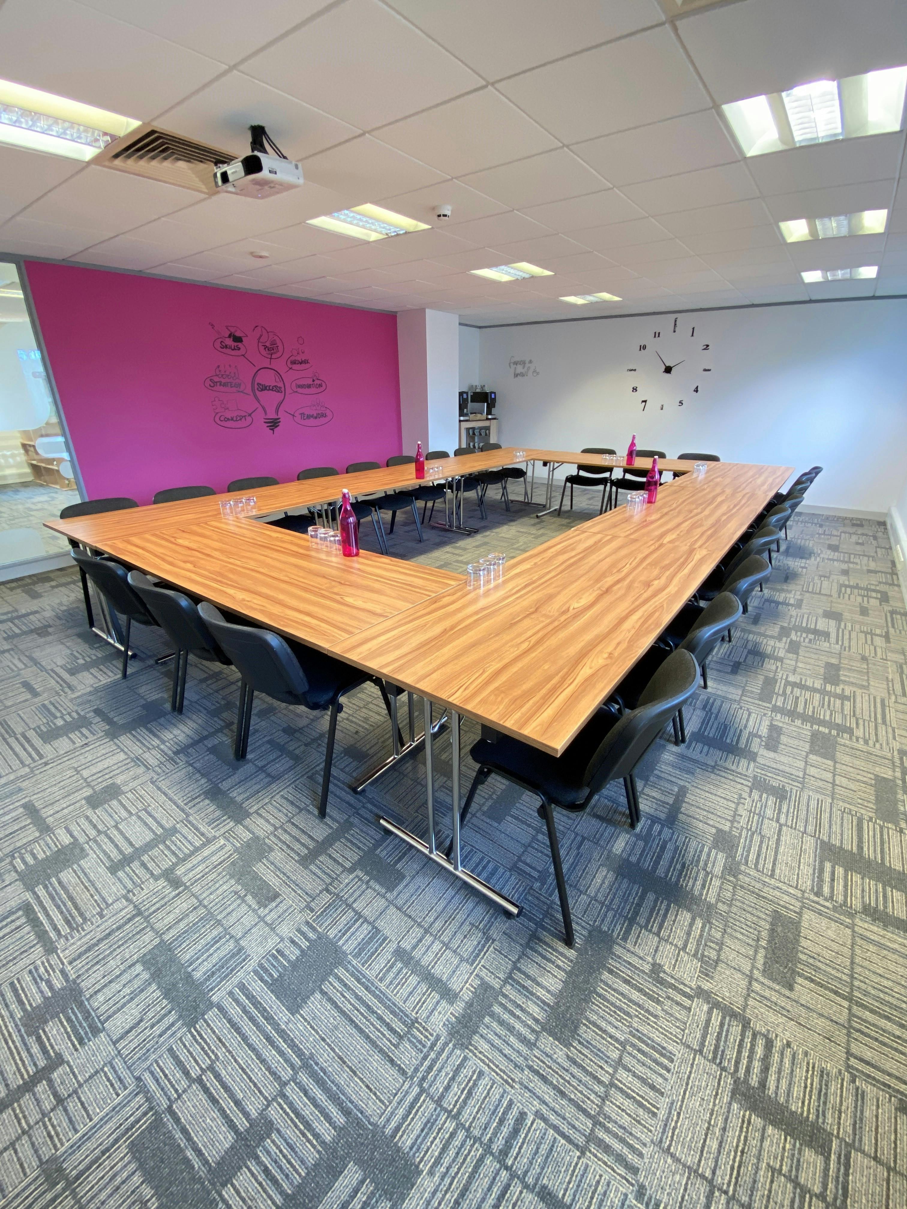 Magenta Suite UBC meeting room with U-shape setup for collaborative discussions.