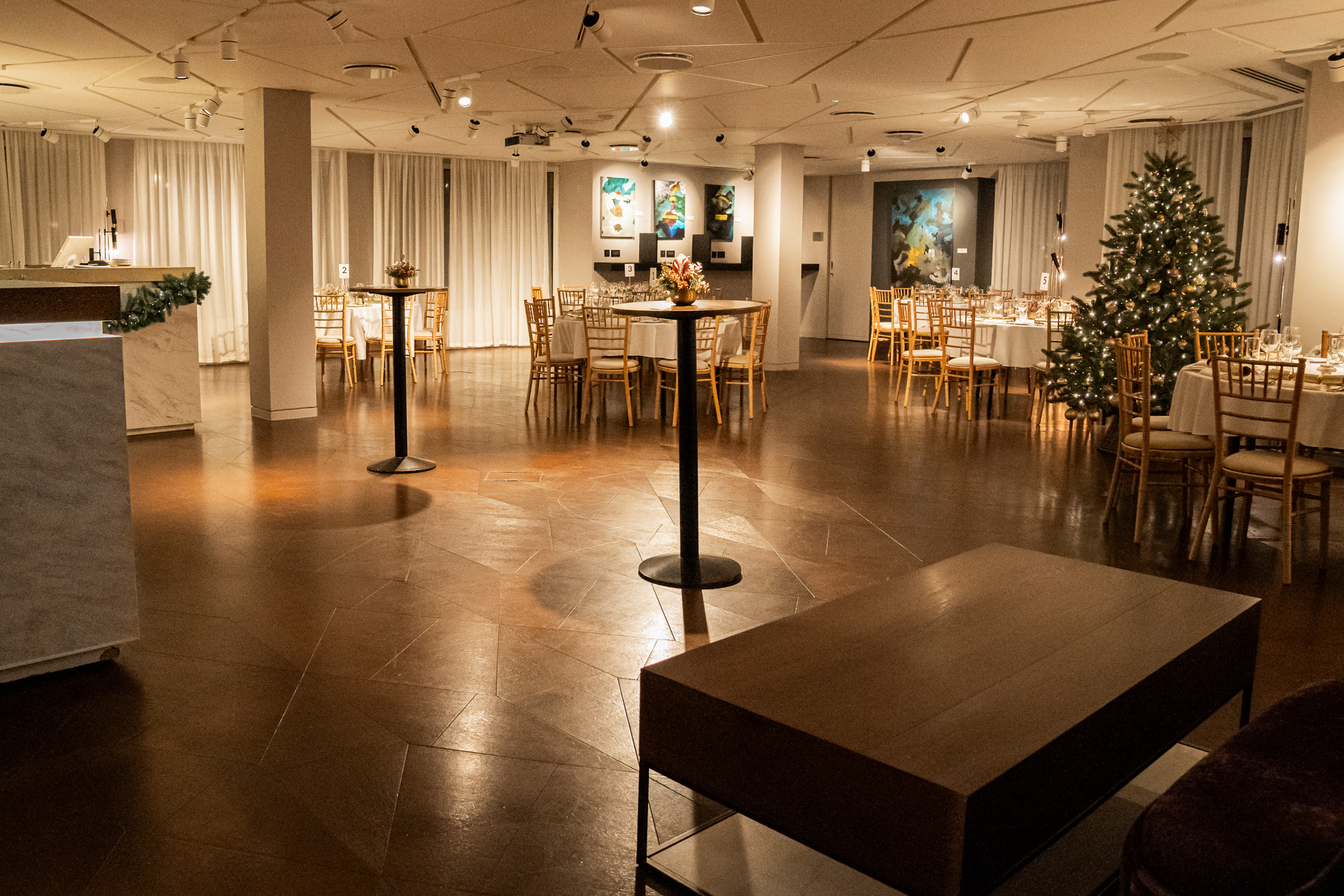 Elegant event space at 12 Hay Hill with Christmas tree for corporate meetings and gatherings. - Banner