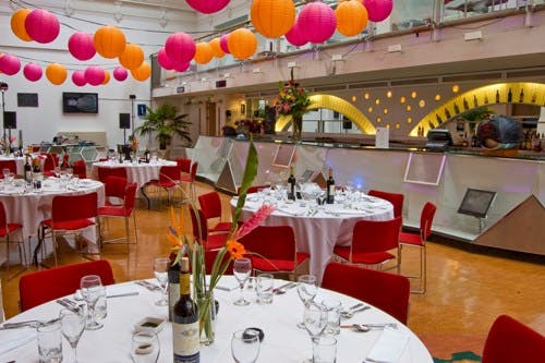 Brighton Dome Foyer Bar set for a corporate dinner with elegant decor and vibrant atmosphere.