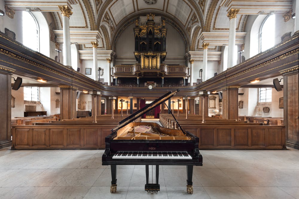 St James's Church Piccadilly with grand piano, ideal for weddings and concerts.