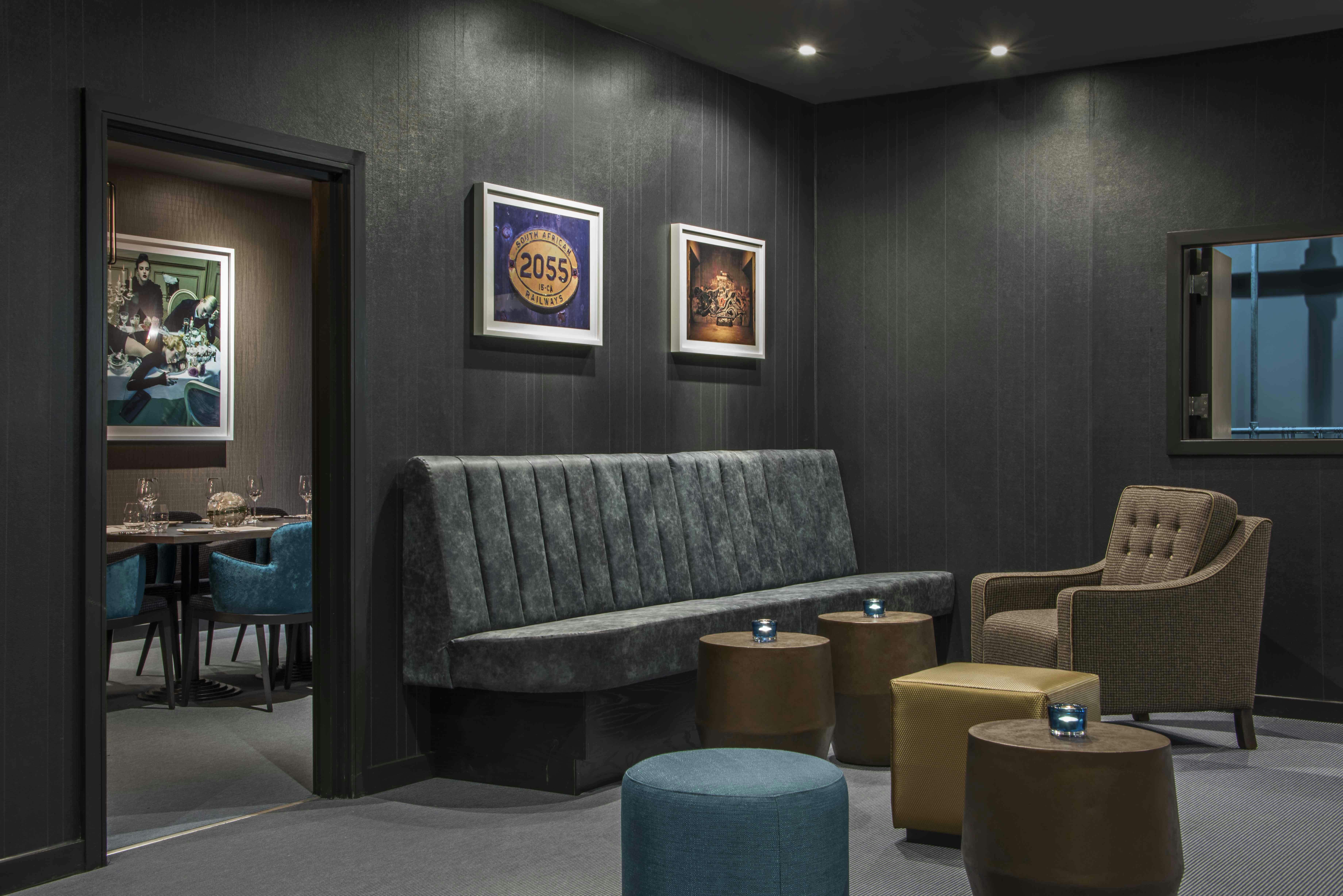 Modern underground meeting space with plush seating for intimate gatherings.