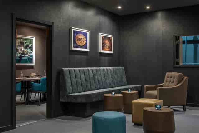 Modern underground meeting space with plush seating for intimate gatherings.