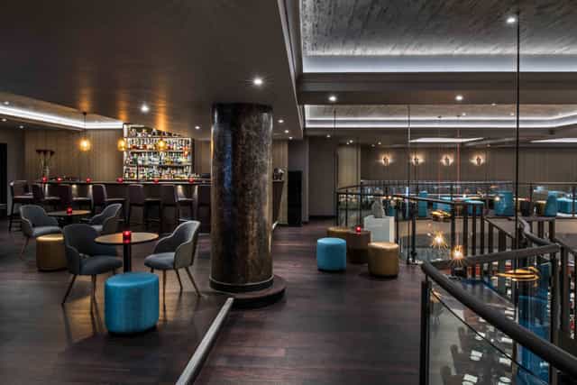 Modern event space with elegant bar, ideal for cocktail receptions and meetings.