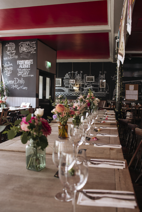 Elegant dining space with fresh flowers for weddings and corporate events. - Banner