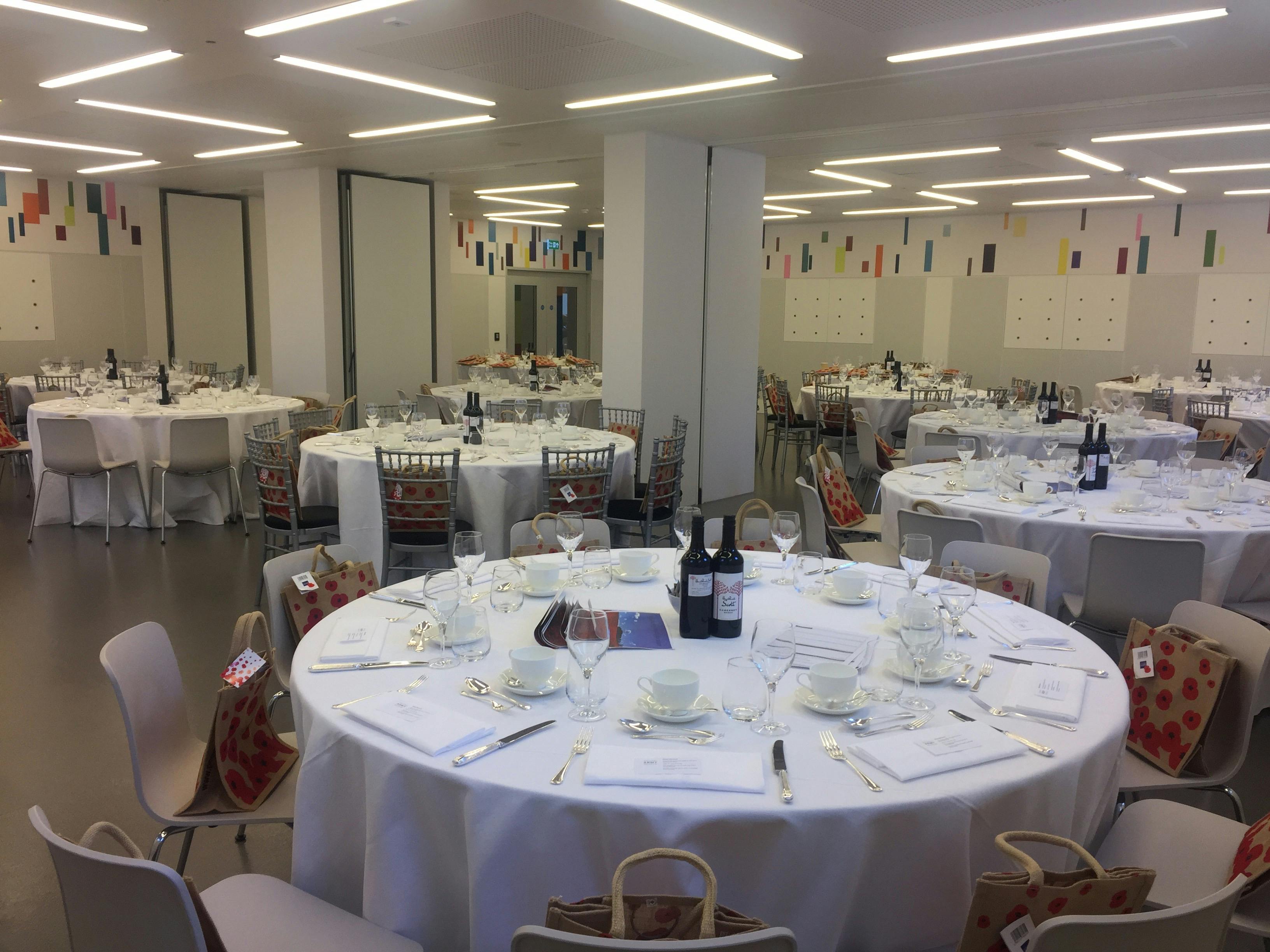 Foyle Centre event space set for formal dinner with elegant tables, ideal for networking.
