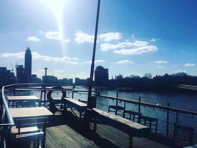 West-Facing Deck at Tamesis Dock, riverside venue for summer events and gatherings.