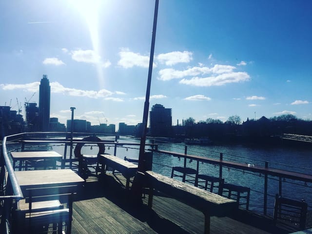 West-Facing Deck at Tamesis Dock, sunlit riverside venue for outdoor events and gatherings.