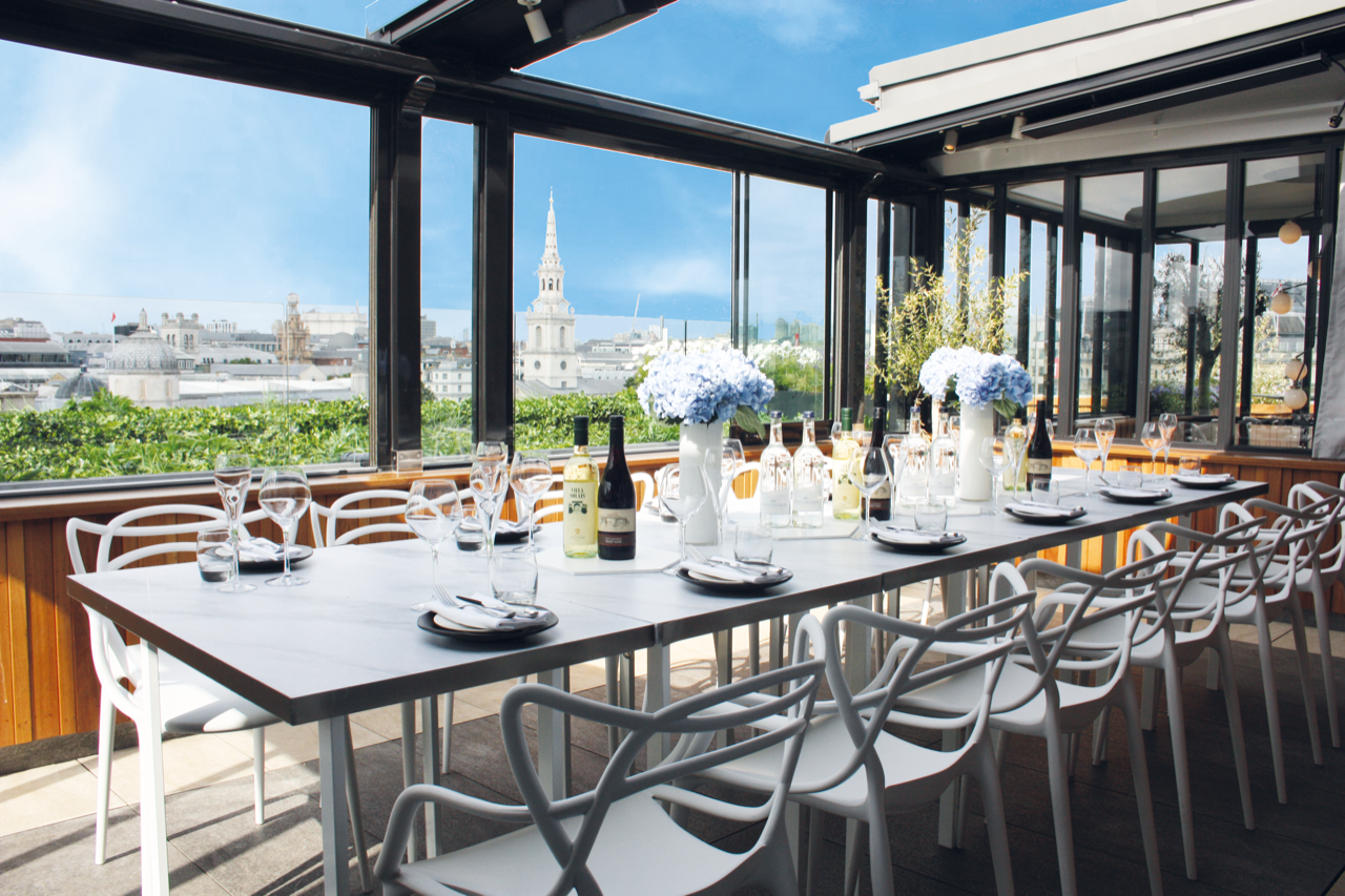 Elegant dining setup at The Rooftop ROOM, perfect for corporate events and celebrations. - Banner