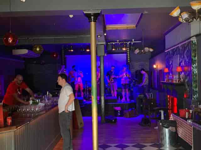 Vibrant event space at The Macbeth bar for live music performances and celebrations.