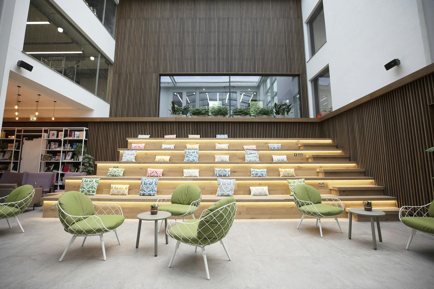 Spitalfields Conservatory event space with tiered seating, ideal for workshops and gatherings.