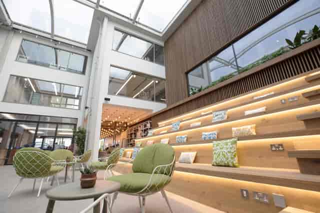 Spitalfields Conservatory: modern meeting space with glass ceiling for events and networking.