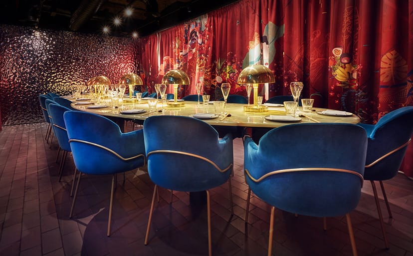 Stylish banquet setting with plush blue chairs in The Rambutan Room, ideal for upscale events.