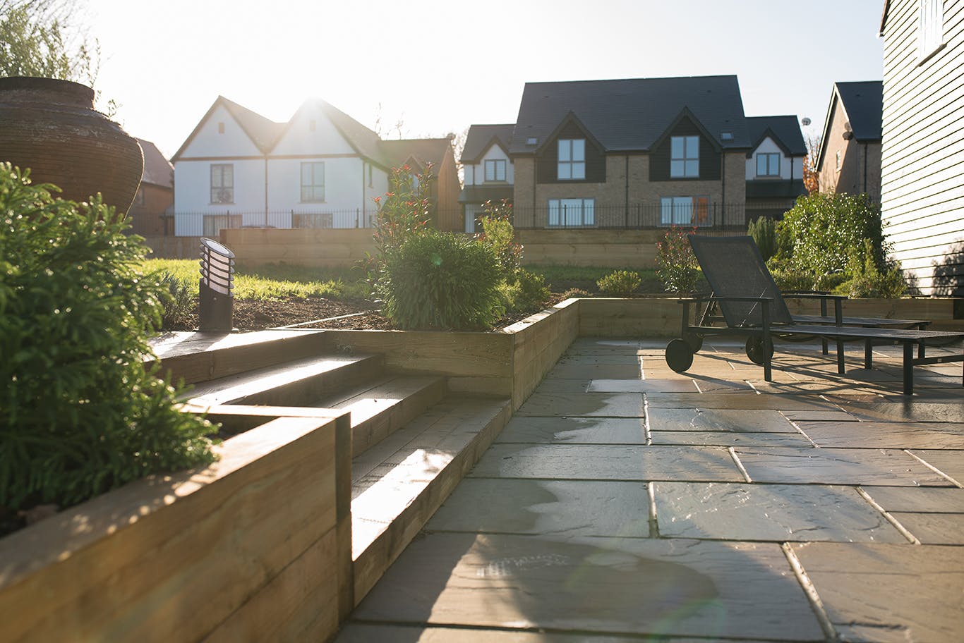 Chantry House outdoor event space with stone patio and lush greenery for gatherings.