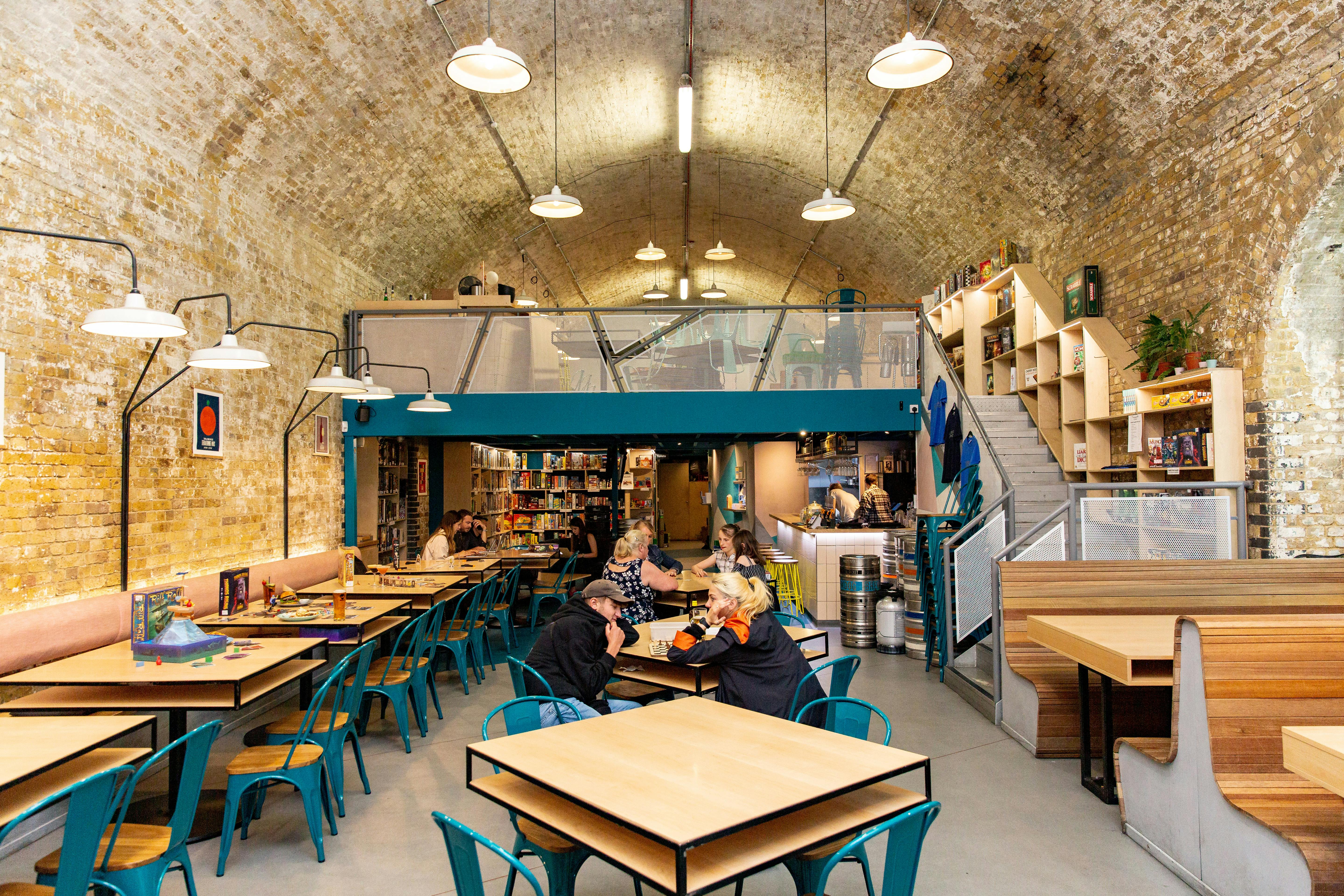 Modern venue with rustic brick walls, perfect for casual meetings and small events.