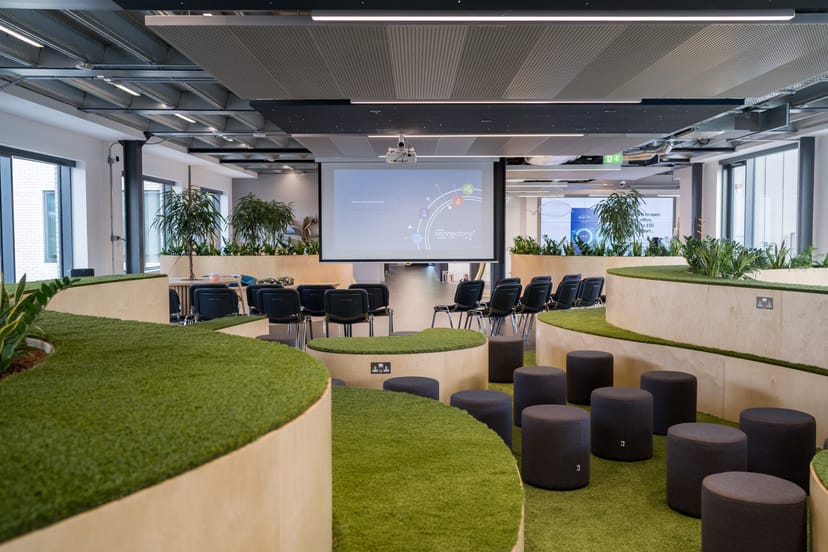 Versatile meeting space in London with tiered seating for presentations and workshops.