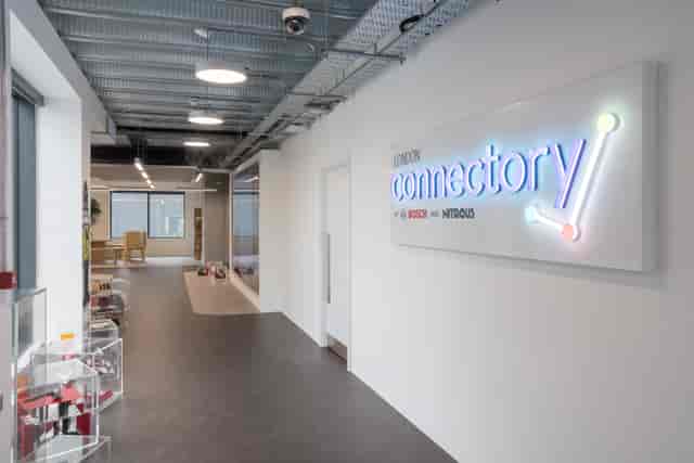 Modern London event space with vibrant ‘connector*y’ signage for networking and meetings.
