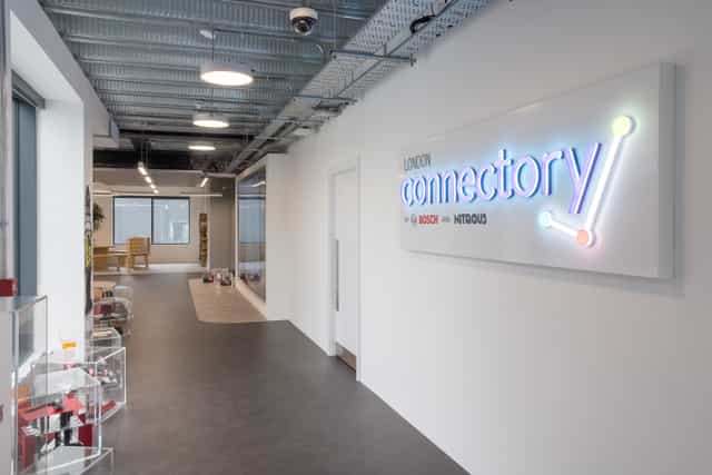 Modern London event space with vibrant ‘connector*y’ signage for networking and meetings.