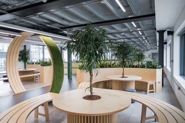 Modern meeting space in London with circular seating for collaborative events.
