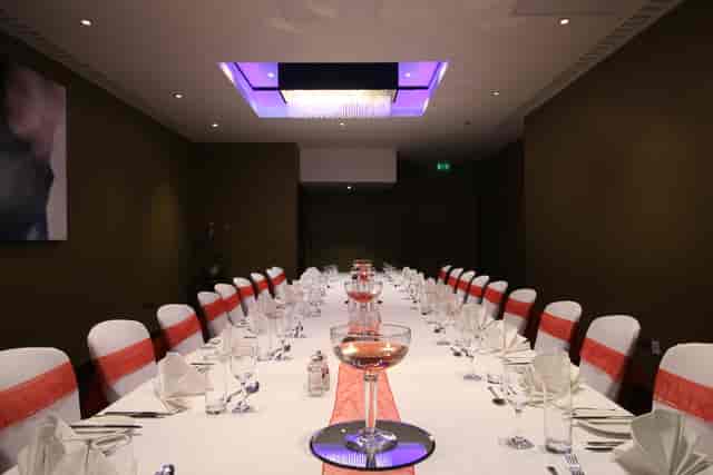Elegant wedding setup with red accents at Holiday Inn Kensington, perfect for events.