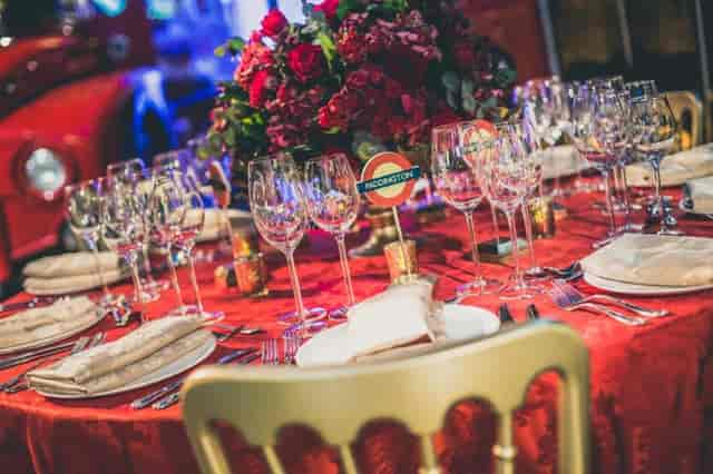 Elegant dining table with floral centerpiece at London Transport Museum event.