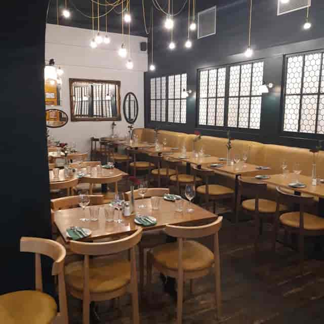 Auberge Waterloo dining room with modular banquet seating for events and restaurant functions.