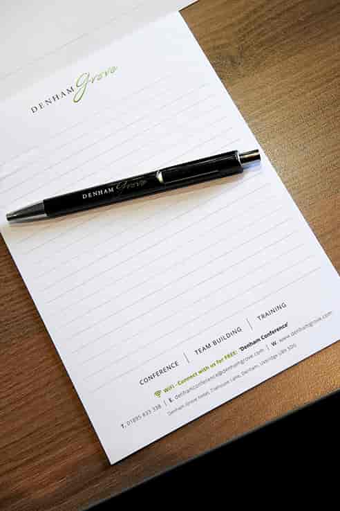 Princess Suite at Denham Grove with branded notepad and pen for meetings and workshops.
