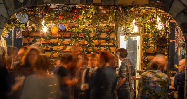 Vibrant Secret Garden Room with lush greenery, ideal for networking events and gatherings.