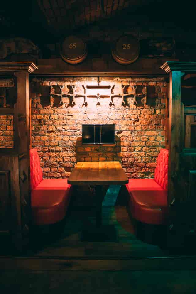 Cozy Brewery Hall with rustic brick wall, ideal for meetings and brainstorming in Liverpool.