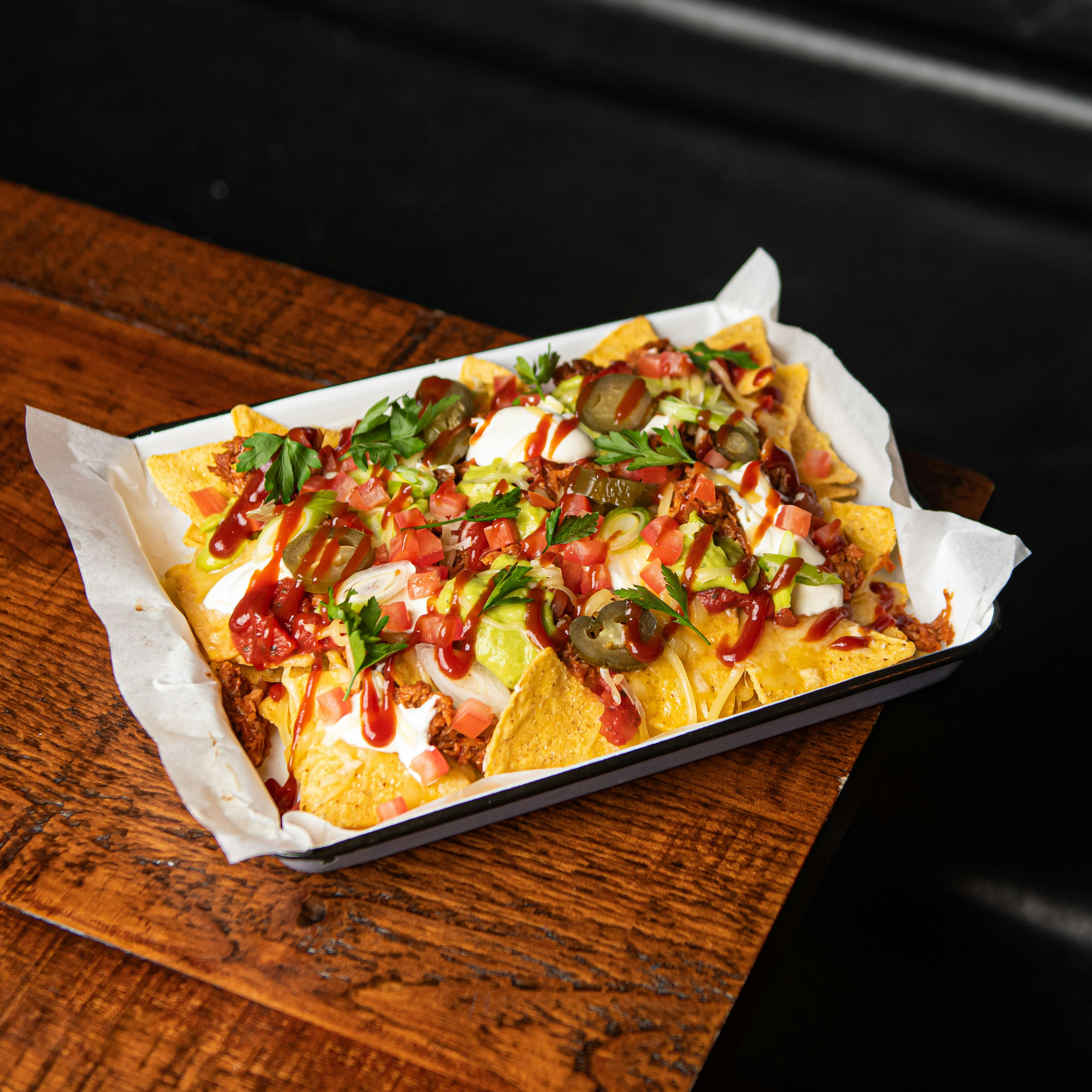 Vibrant nachos platter at Brewery Hall, perfect for casual gatherings and networking events.