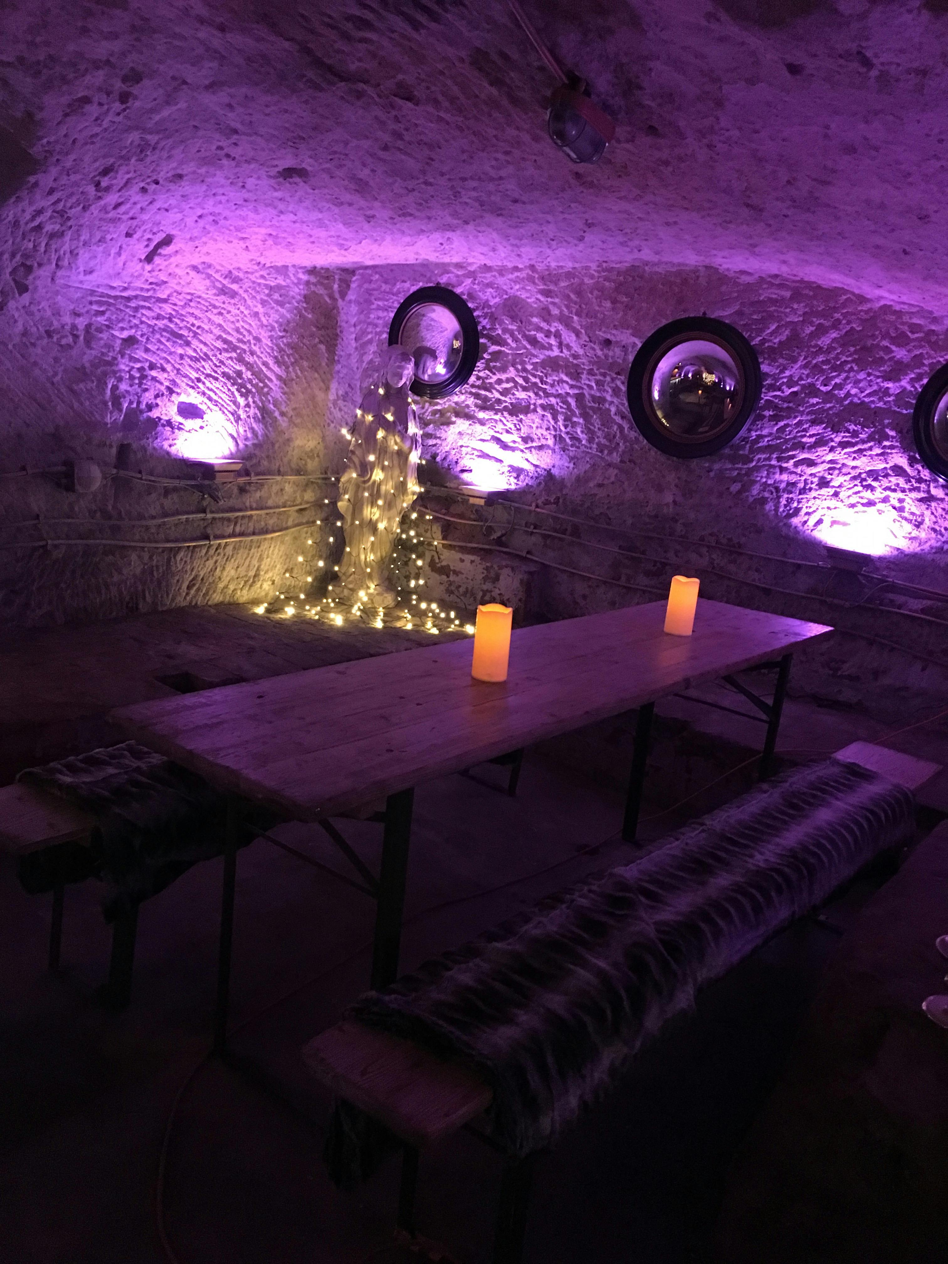 Lost Caves event space with rustic table, ideal for intimate dinners and gatherings.