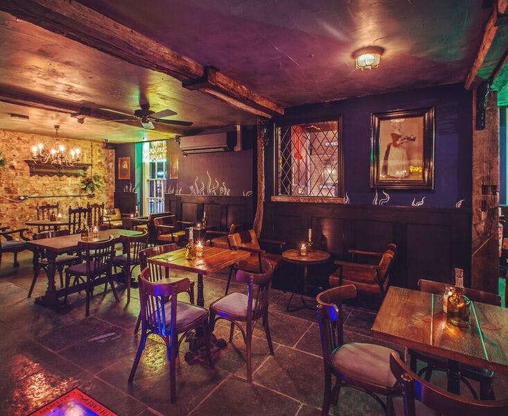 Cozy Curious Tavern venue with warm lighting, ideal for private events in Nottingham.