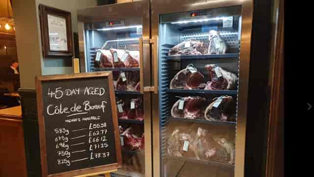 High-end meat display of Côte de Boeuf at upscale dining event in The Royal Oak.