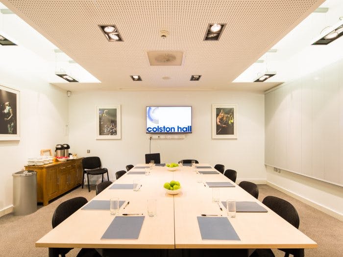 Meeting Room 1 at Colston Hall, featuring a long table for corporate events and presentations.