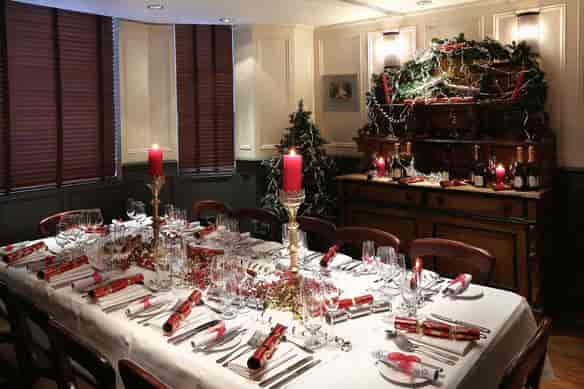 Elegant dining table setup in The Mandeville Hotel for festive events or corporate gatherings.