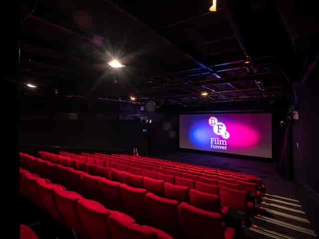 Modern cinema at BFI Southbank with vibrant red seating for film screenings and events.