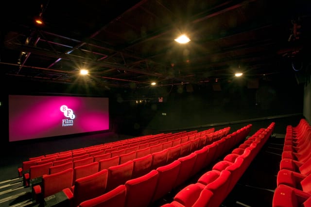 Modern screening room at BFI Southbank with plush red seating for film events.